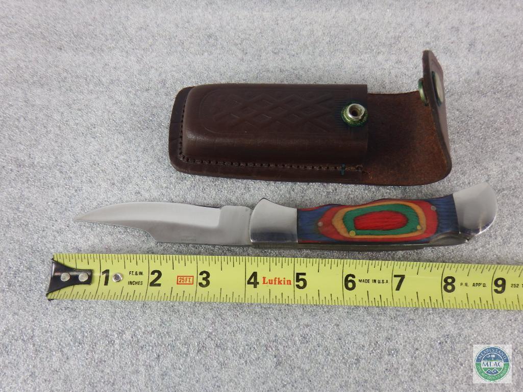 Folding pocket knife with belt sheath