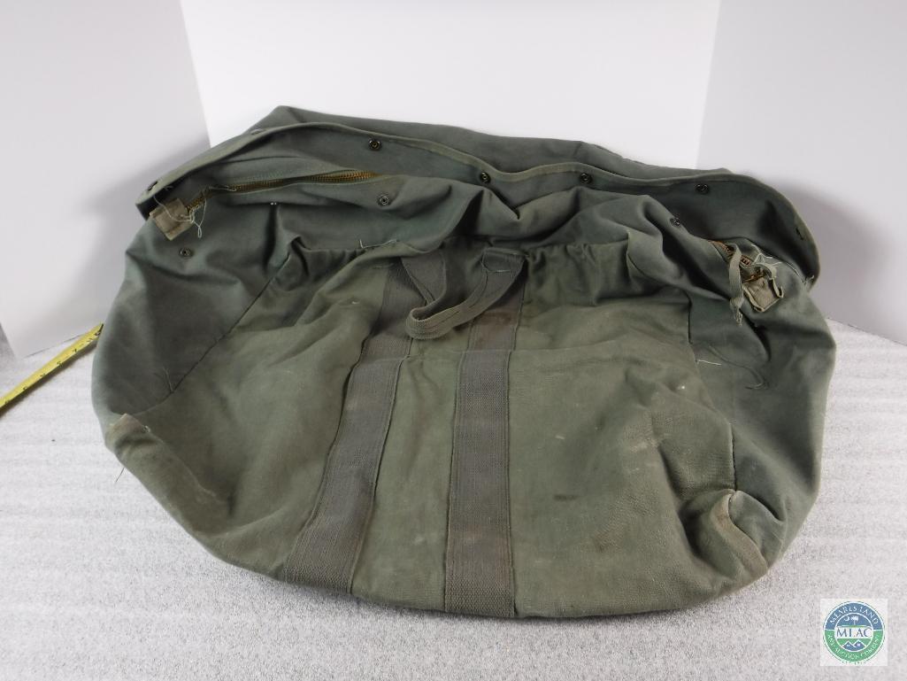 Olive drab colored canvas military duffle bag