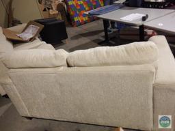 Cream colored love seat