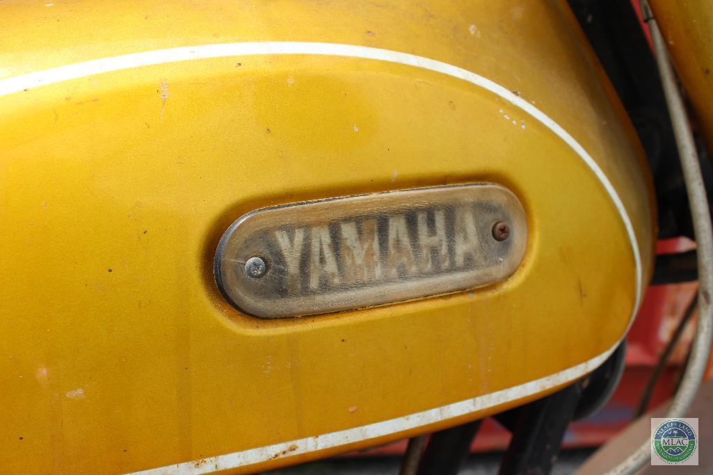 Gold Yamaha 175 motorcyle