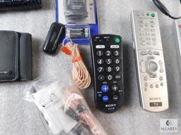 Lot of Electronic Items Remotes, Cell Phone, Cases, and Power Cords