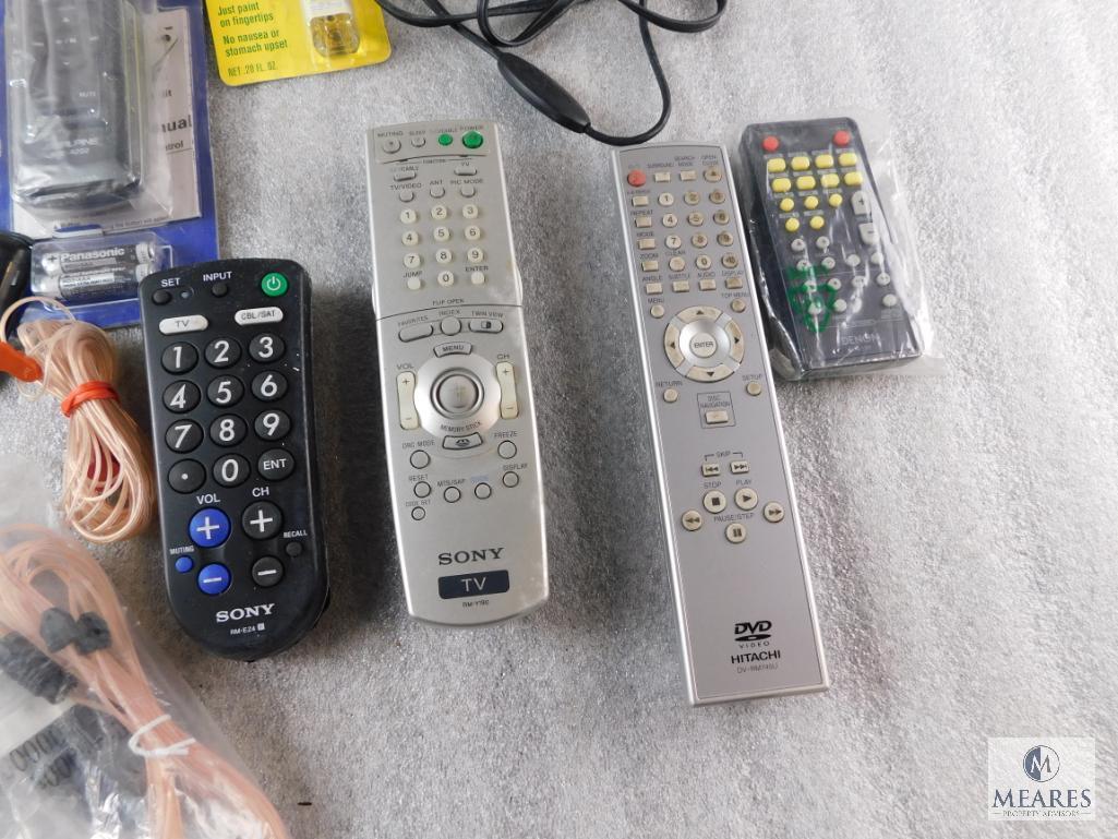 Lot of Electronic Items Remotes, Cell Phone, Cases, and Power Cords