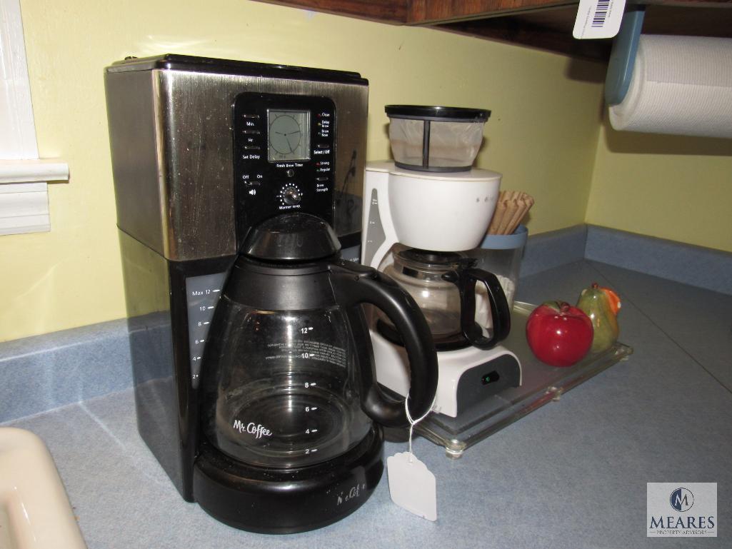 Counter lot includes 2 mr. Coffee makers salt and pepper shaker and glass cutting board