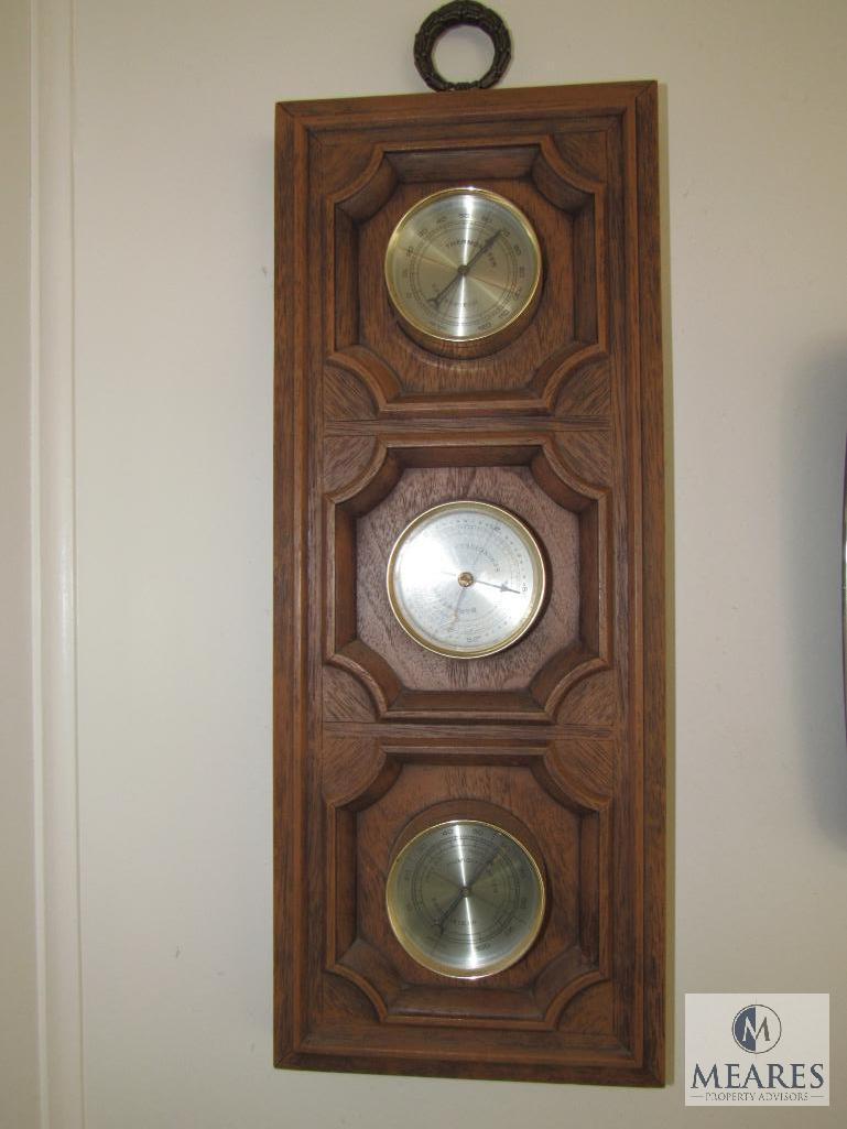 Contents of sunroom walls includes clock, weather gauge, and pictures