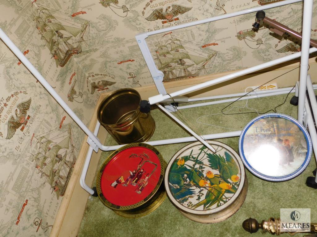 Lot portable clothes racks (2) with hangers, curtain rods, and vintage tins