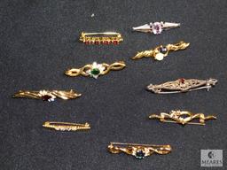 Assorted costume bar pins