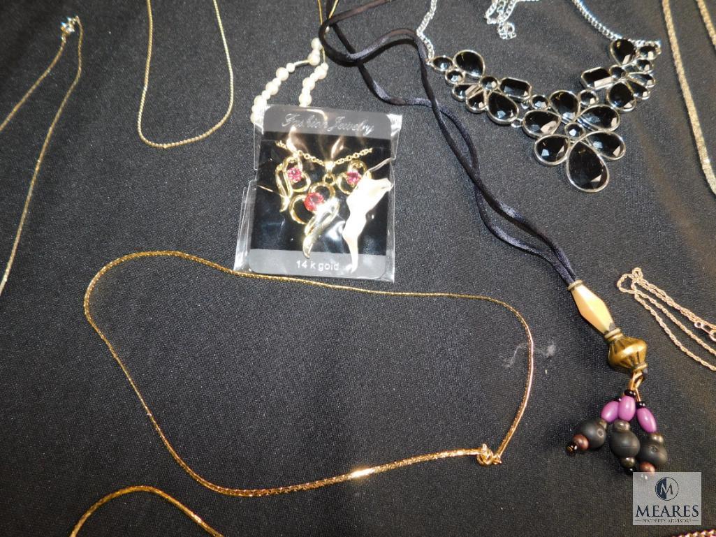 Lot of costume necklaces and chains -some broken