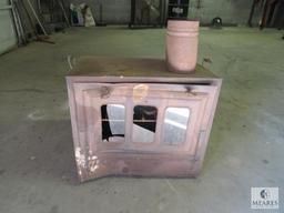 Old metal wood burning heater or oven