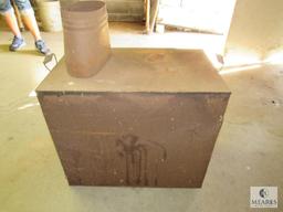 Old metal wood burning heater or oven