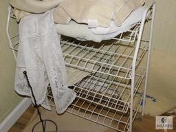 Wire Rack with assorted Rugs and Towels