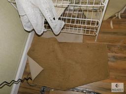 Wire Rack with assorted Rugs and Towels