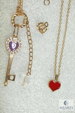 Lot of 2 Costume Jewelry Bracelets - gold tone with heart charm & skeleton key with rhinestones