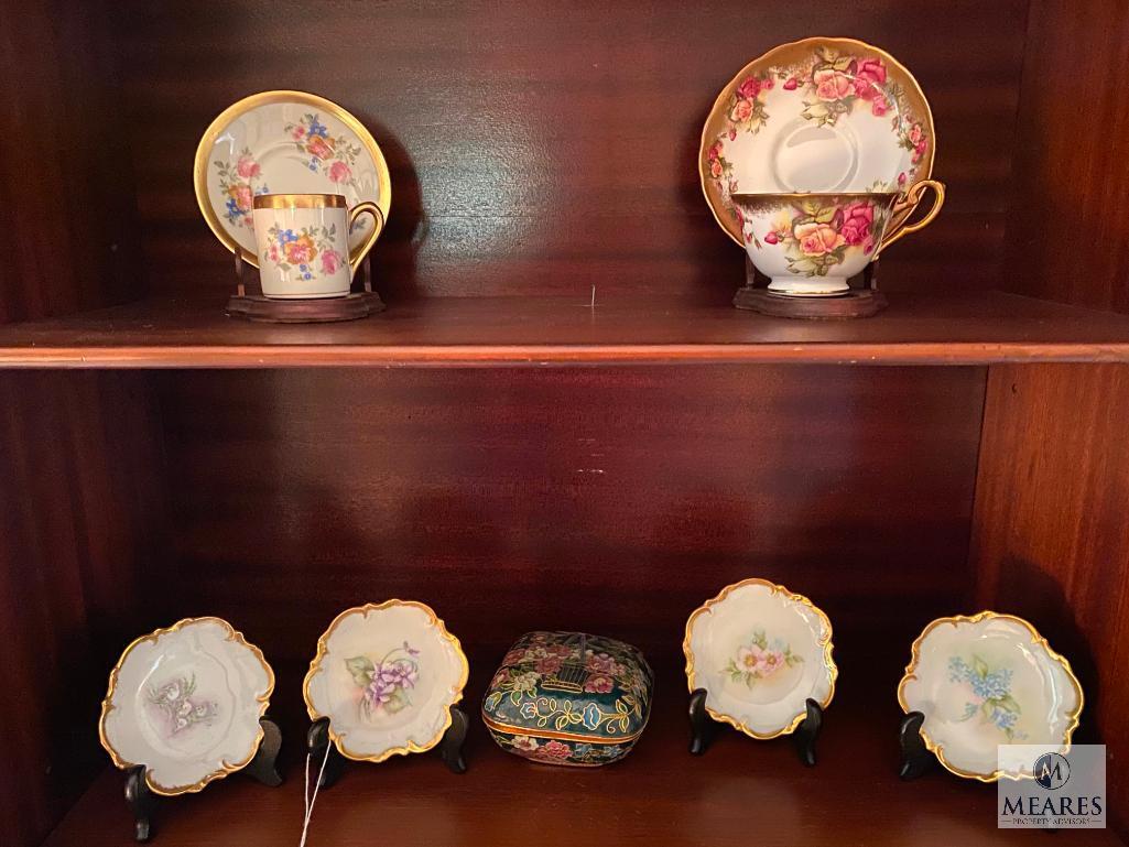 Contents of the china cabinet including porcelain vases, teacups, saucers, bowls