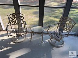 Two Metal Outdoor Swivel Chairs and Small Table