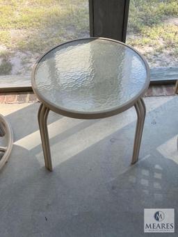 Two Metal Outdoor Swivel Chairs and Small Table