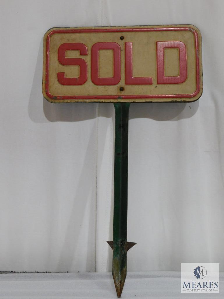 Two Sided Metal Sold Sign on a Metal Post