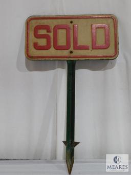 Two Sided Metal Sold Sign on a Metal Post