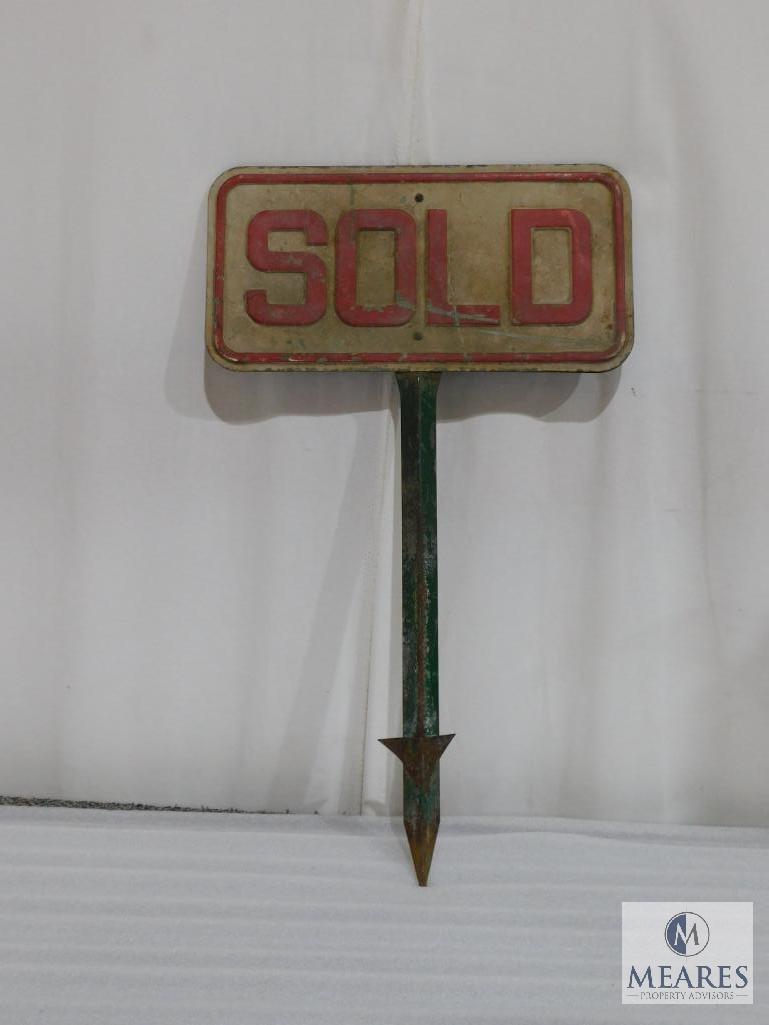 Two Sided Metal Sold Sign on a Metal Post