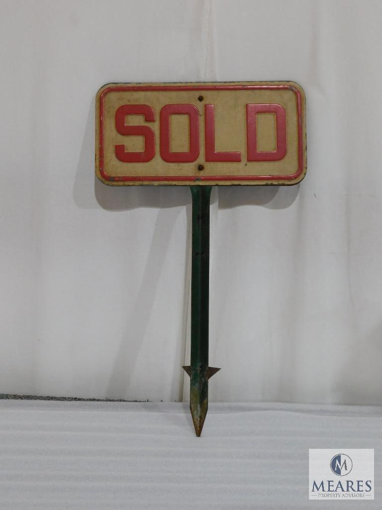 Two Sided Metal Sold Sign on a Metal Post