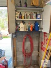 Contents of Cabinet in Garage with Water Hose