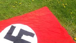 German Nazi flag that measures 6.2 x 3.7. Note, we do not condone the atrocities committed by the