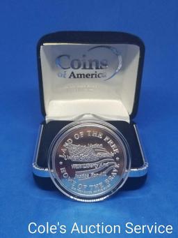 Coins of America Land of the Free one troy ounce fine silver coin. Beautiful mirror-like finish in