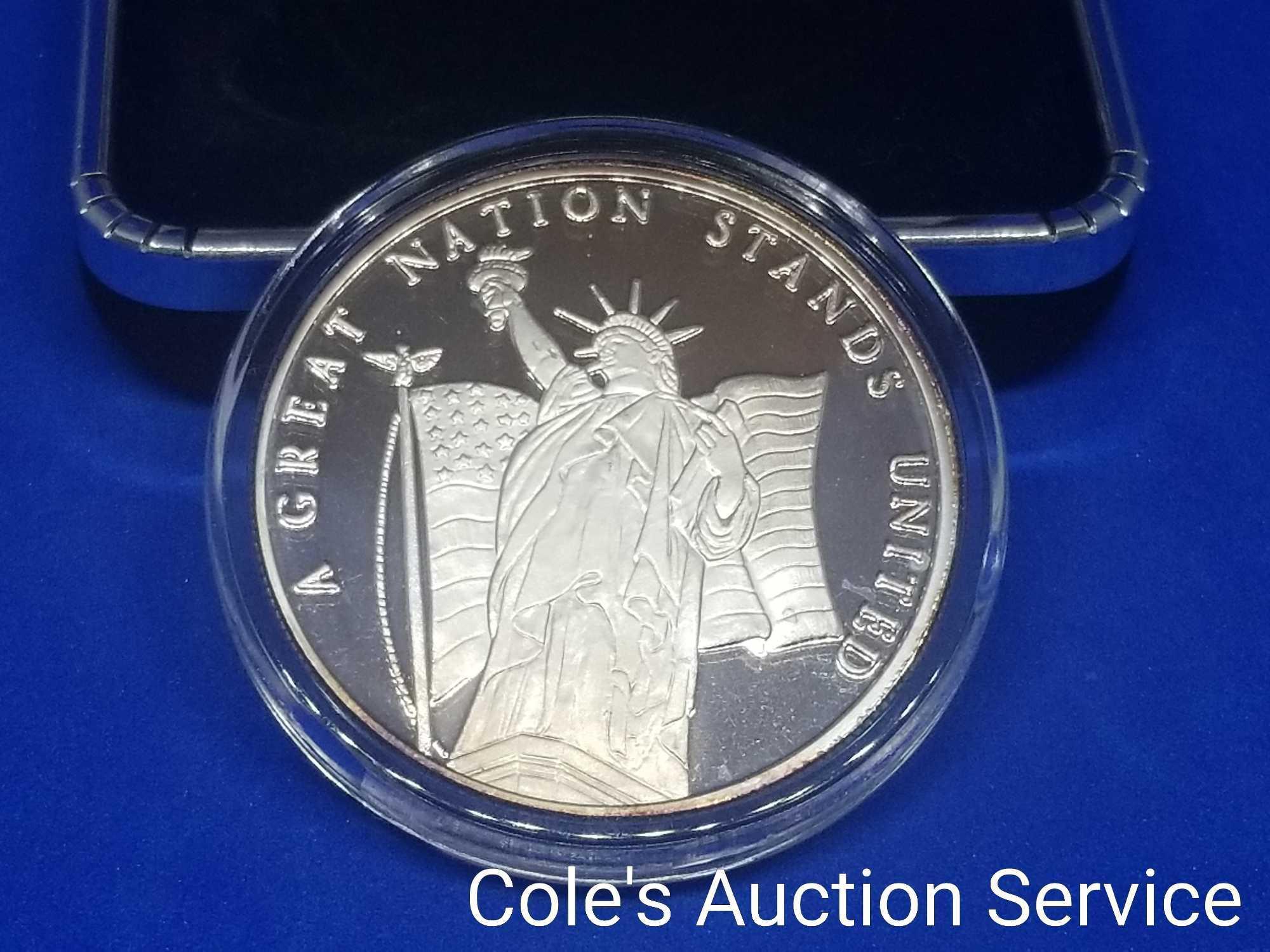 Coins of America Land of the Free one troy ounce fine silver coin. Beautiful mirror-like finish in