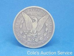 1890 United States Morgan silver dollar. See photos for details.