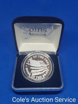 Land of the Free one troy ounce silver coin in display box. Beautiful mirror-like finish.