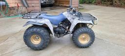 Older Yamaha quad in fair condition. Features manual transmission, new tires, front and rear racks,