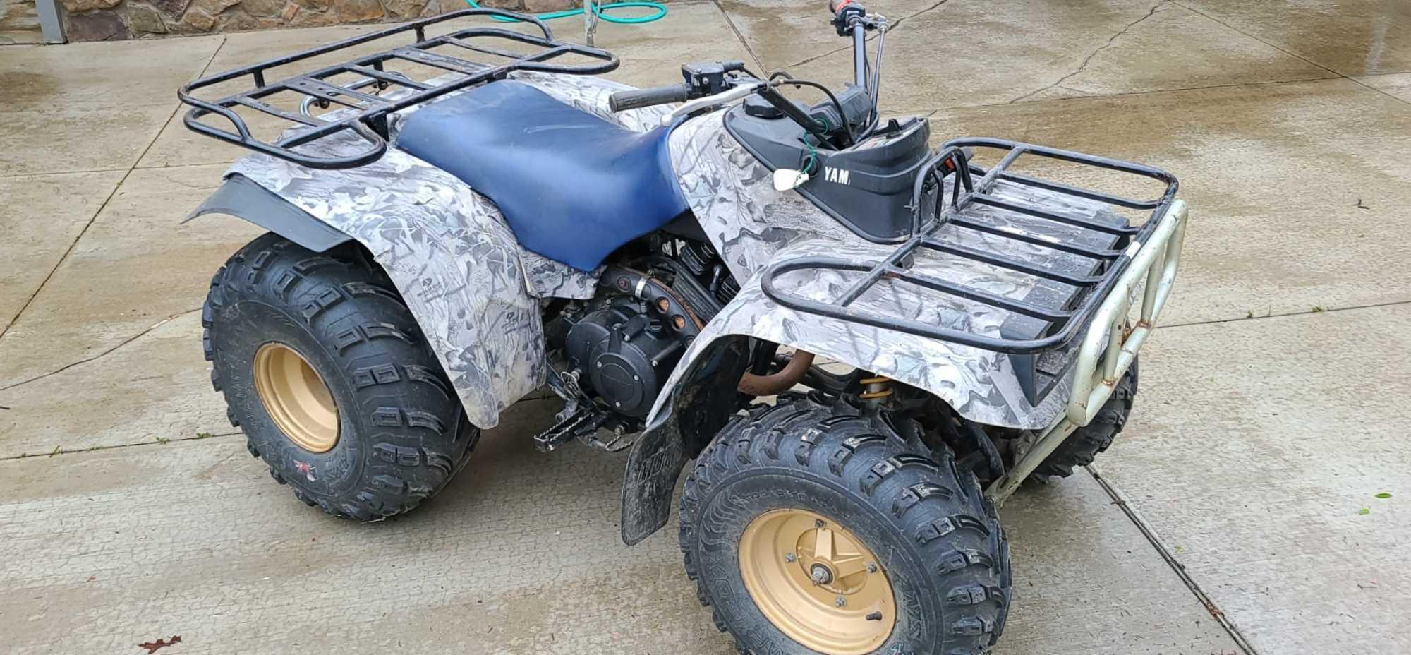 Older Yamaha quad in fair condition. Features manual transmission, new tires, front and rear racks,