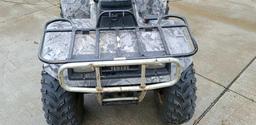 Older Yamaha quad in fair condition. Features manual transmission, new tires, front and rear racks,