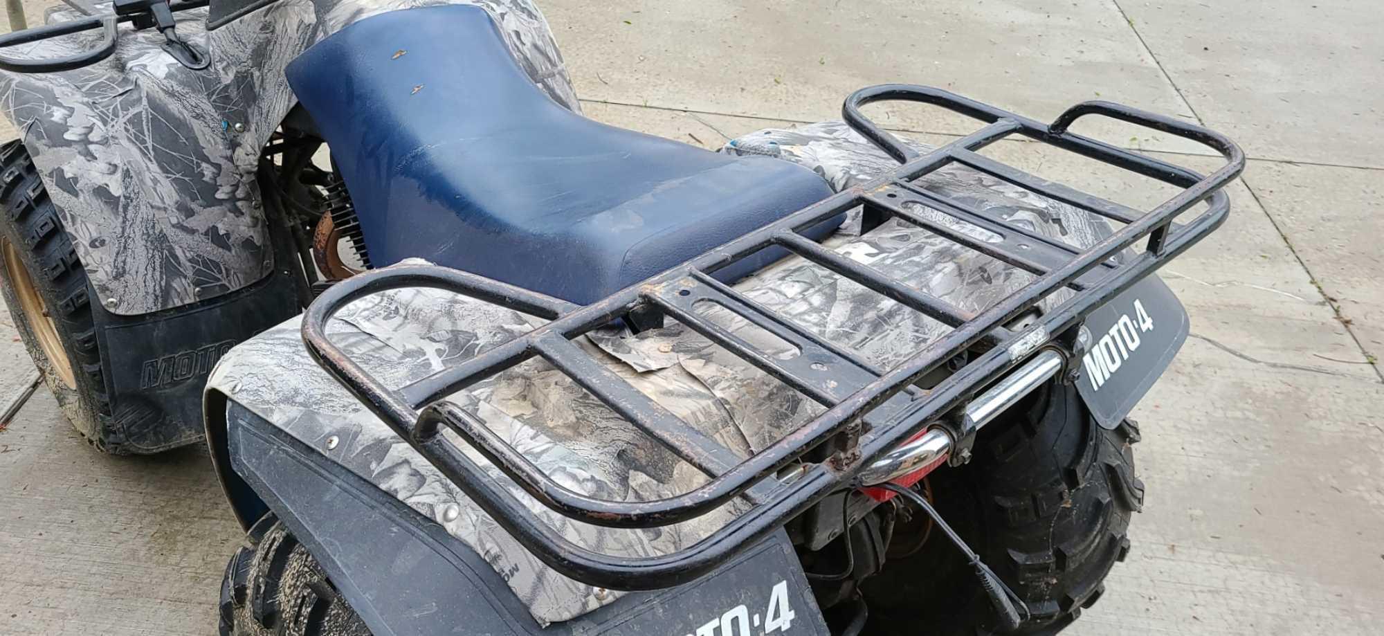 Older Yamaha quad in fair condition. Features manual transmission, new tires, front and rear racks,