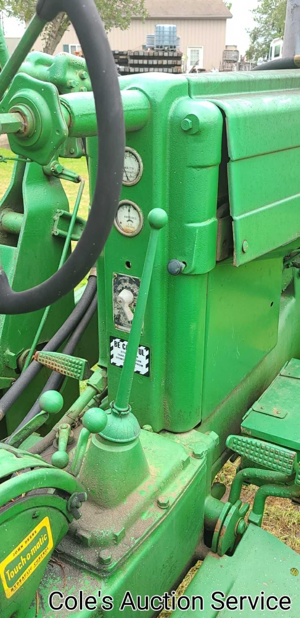 1950 John Deere Mt row crop tractor. In great condition, runs and drives excellent. Serial number