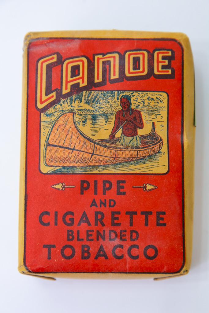 Canoe sealed tobacco package & contents