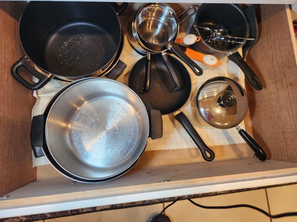 Contents of bottom Cabinets/Drawers Below Stove