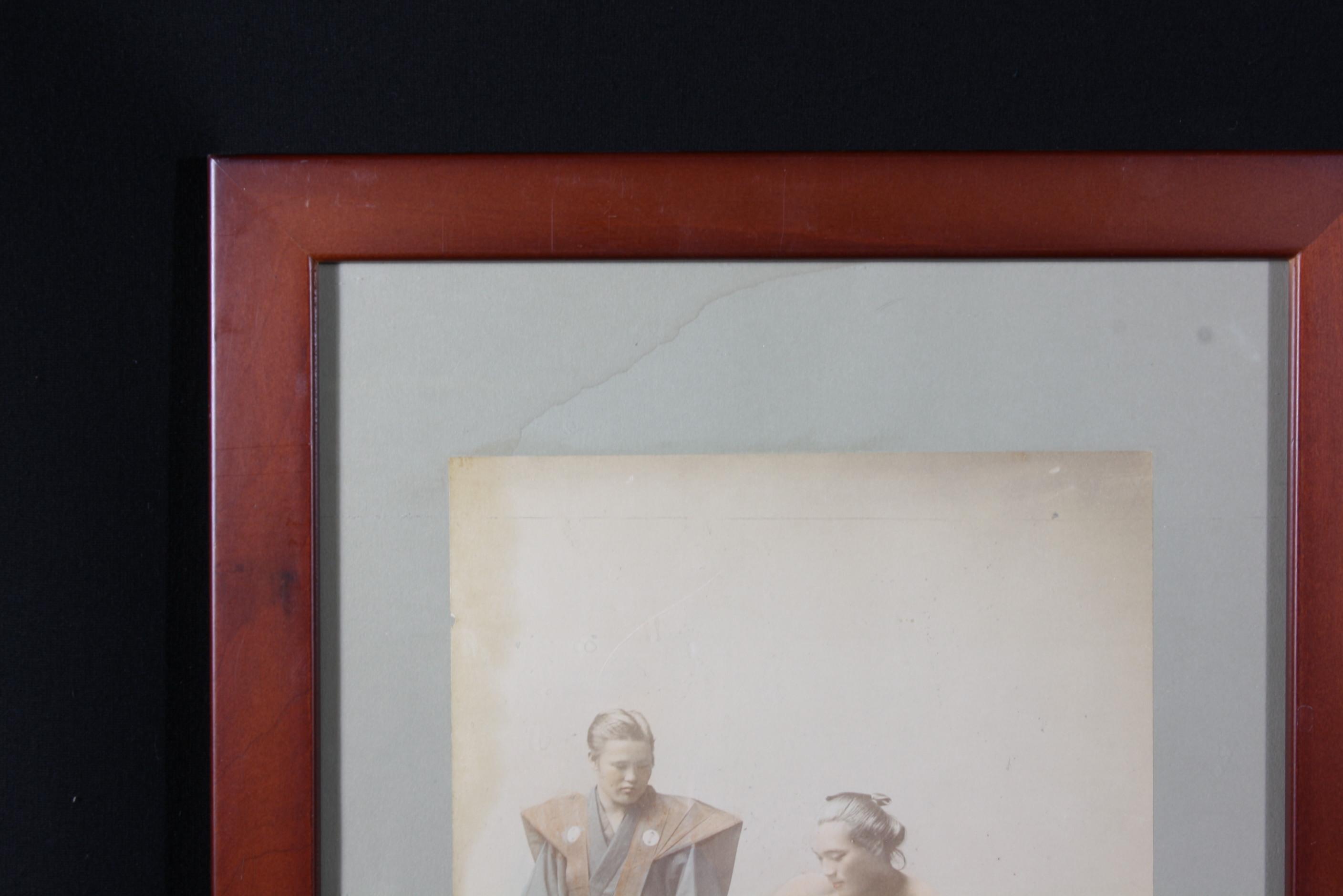 Framed  hand tinted photo of Japanese sumo wrestlers