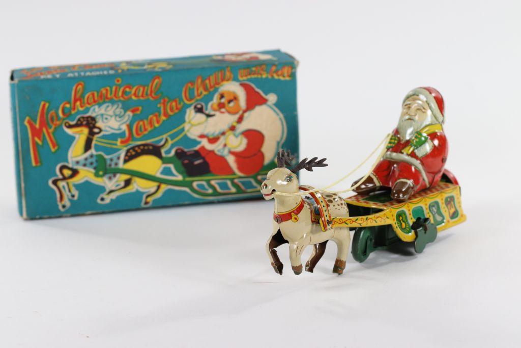 1950’s wind-up “Mechanical Santa Claus with bell”