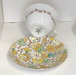 Five Tea Cups And Matching Saucers