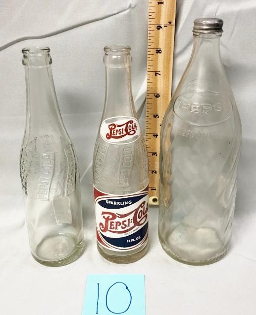 Three Pepsi Bottles