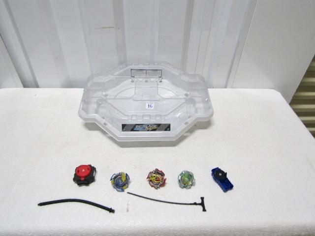 Beyblades And A Battle Stadium For Them Plus Accessories Shown