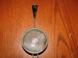 Small Strainer W/ Black Bakelite Handle That Is Embossed M D