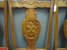 6 Wood Chairs w/ Ornate Carved Motif w/ Man on Barrel Carved Medallion & Red Leather Seats