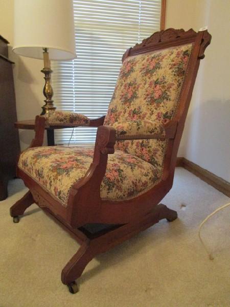 Wooden Rocking Chair Ornate Curled Top Carved Sides, Grooved Arms