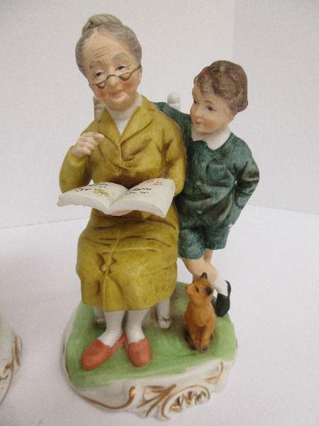 Pair - Bisque Figurines Elderly Man & Woman Reading To Grandchildren