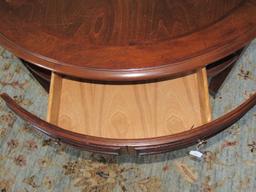 4 Wooden Drawer Round Coffee Table Narrow To Caster Feet, Grooved Columns Panel Motif