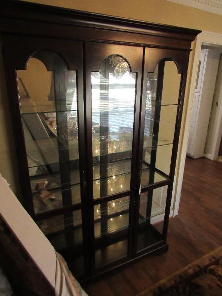 Tall Dark Wooden Display Cabinet 4 Glass Shelves, 2 Brass Pulls, 2 Doors, Curved Skirt