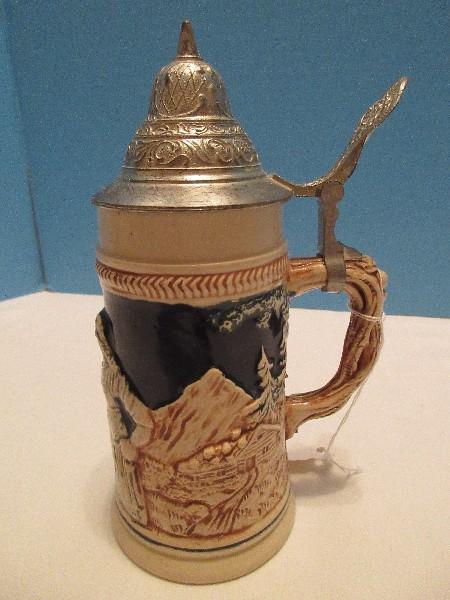 Western Germany Beer Stein w/ Lid Relief Design Couple Cabins & Mountain Background