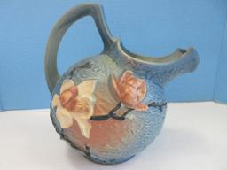 Roseville Pottery Magnolia Pattern Ball Cider/Water Pitcher Blue Background Black Stems