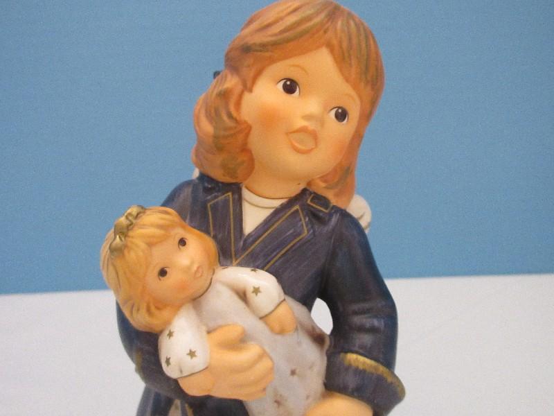 Goebel Hummel Porcelain 8" Cherub Angel Holding A Doll Figurine